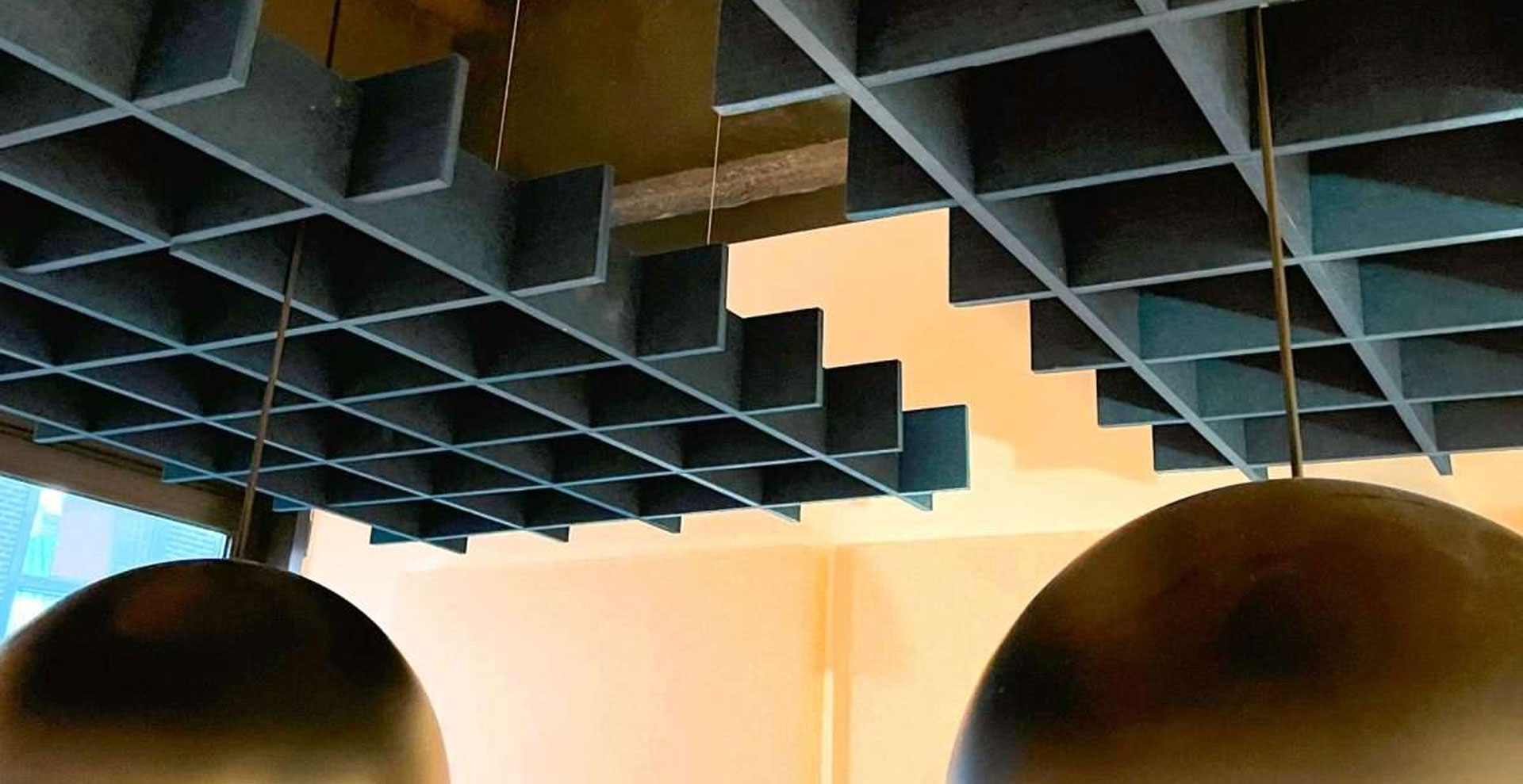 ceiling acoustic panels installed in modern office reducing echo, improving sound clarity and creating noise-free interior with premium acoustic treatment